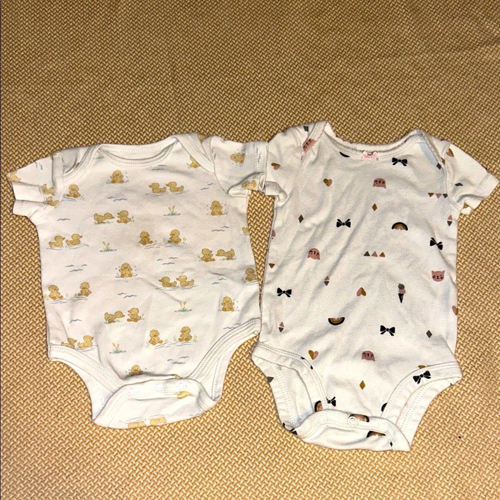 Two adorable baby onesies